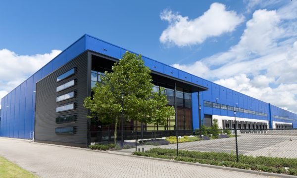 modern blue warehouse in the Rotterdam harbor area